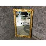 Gilt ornate framed rectangular shaped mirror