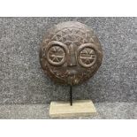 Ethnic sculpture, face on stand