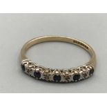 9ct yellow gold 10 stone eternity ring comprising of 4 diamonds and 5 blue stones size O 1.43g