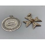 Silver Greek key pattern pendant 5cm diameter 7.7g and a large silver and marcasite cross pendant