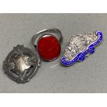 2 hallmarked silver badges including mother craft training society & AWG, together with a silver red