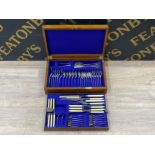 Vintage canteen of cutlery - a solid Oak casing with brass twin handles containing 61 piece