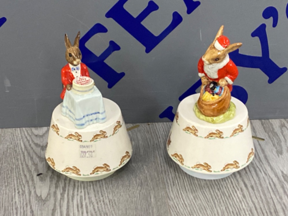 A pair of royal Doulton Bunnykins on musical bases, Santa- plays white xmas and happy birthday to