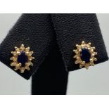 A 9ct gold sapphire and diamond cluster earrings, 1g