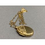 9ct gold oval locket and 9ct gold necklace, 3.2g 44cm
