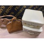 Two vintage white suitcases (1960s) and two tan coloured Holdalls