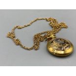 Gilt Skeleton pocket watch on 9ct yellow gold chain, 5.4g