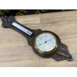 Carved oak Reynolds & Son barometer