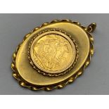 1911 George V sovereign coin pendant - lot comprises of a 22ct gold coin in a 9ct mount - 12.5G