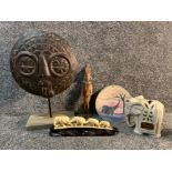 African themed carvings, sun god mask on stand etc