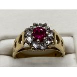9ct yellow gold ladies dress ring with large pink stone surrounded by cz’s, size J 3.3g