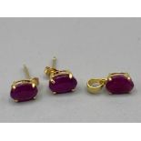 9ct gold pendant and earrings all with matching pink stone,1.2g