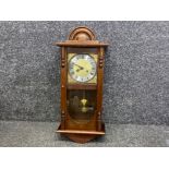 German Mahogany cased “Manley” wall clock with pendulum