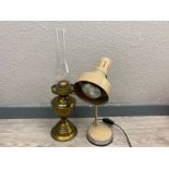 Antique brass based oil lamp with glass chimney together with a vintage metal desk lamp