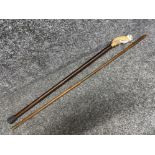 Vintage owl handle walking stick together with an Antique firearm maintenance cleaning rod