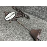 Cast metal outdoor bell with “Welcome” design