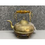 Antique brass kettle with amber glass handle