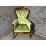 Victorian metal studded mahogany framed spoon back armchair (green buttoned back fabric)