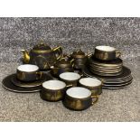 A collection of mount Fiji tea set in black and gold