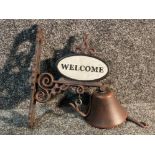 Cast metal out door bell reading Welcome