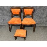 Pair of Victorian chairs, upholstered in an orange fabric with a matching footstool