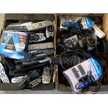2 boxes containing multi bit screwdriver, Fujifilm camera, TV remotes etc