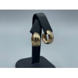 9ct yellow gold hoop earrings with butterfly backs hallmarked London 1977 weighing 3.2 grams