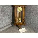 Stunning mahogany wall clock with pendulum and key. Includes service papers