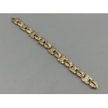Ladies 14ct gold ornate diamond bracelet. 19cms 36.46g. Each link set with round and baguette cut