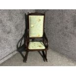 Antique mahogany framed rocking chair with silk stitching covers