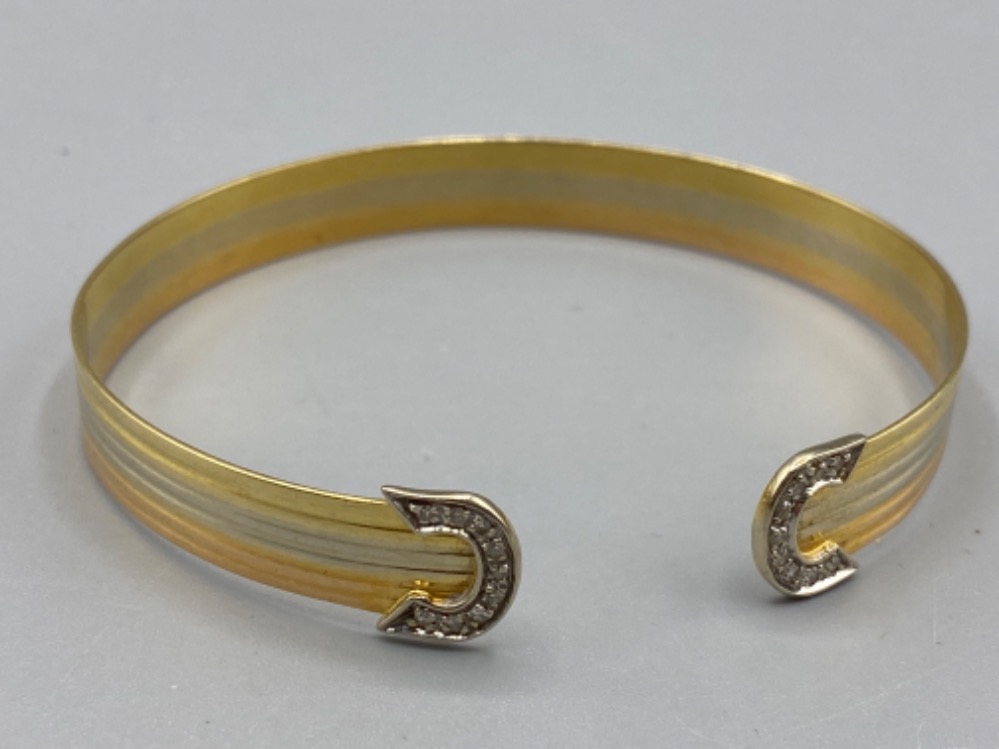 Well presented 18ct 3 tone diamond bangle (12.43g)