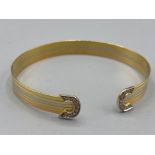 Well presented 18ct 3 tone diamond bangle (12.43g)