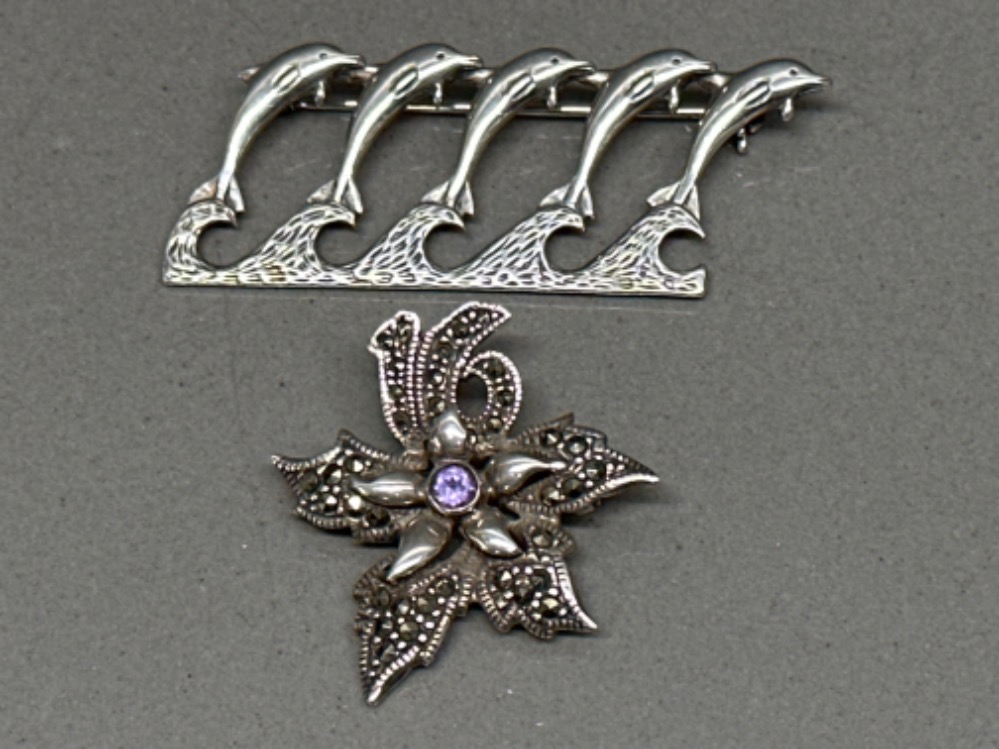 Silver Dolphin brooch and silver, Marcasite & amethyst ‘Flower’ brooch - 12.9G gross