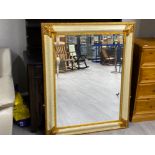 Modern gold framed wall hanging mirror with bevelled edge 125x100cm