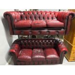 Two red leather chesterfield 3 seater settees