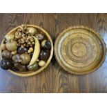 Large circular shaped wooden plaque & fruit bowl containing a large quantity of hand carved fruit