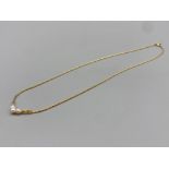 9ct gold necklet set with three cultured pearls 3.5g