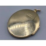 Heavy 9ct gold oval locket pendant (8.67g)