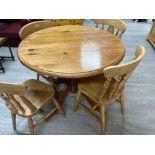 Circular topped pine pedestal dining table & 4 matching chairs