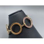 9ct Yellow Gold and Pink Sapphire Circlet Bracelet - Weighing 22.95 grams - Measuring 17cm in length