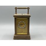 19th century brass carriage clock with enamelled circular dials & original hands, bevelled glass
