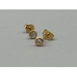 Ladies 18ct gold diamond stud earrings (.58g)