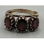 9ct yellow gold “Trilogy Garnet” ring - size P, 4.1g gross, ring comprises of three large oval