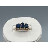 18ct Yellow Gold Three Stone Oval Sapphire Ring in Fancy Mount - Weighing 5.56 grams - Size K