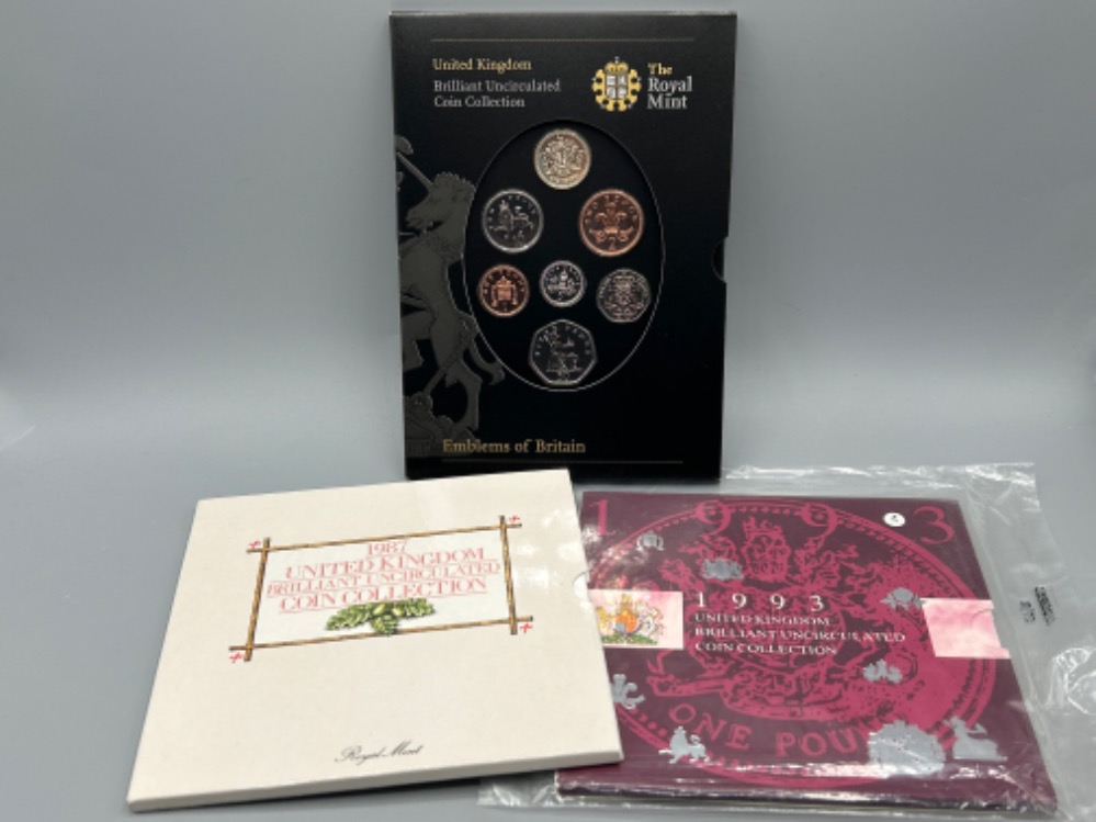 3 Royal mint UK Brilliant uncirculated coin collections, 1987, 1993 and Emblems of Britain