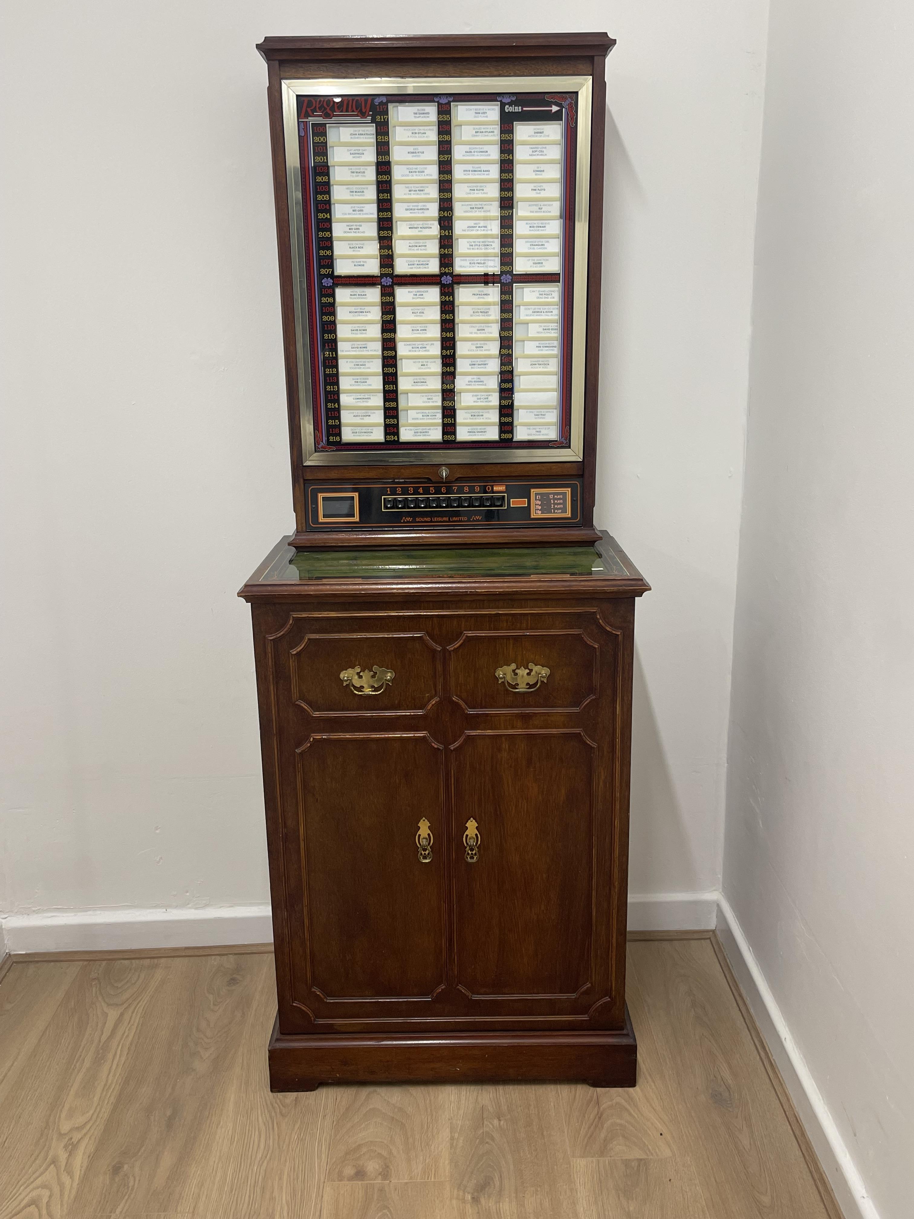 Regency “Sound leisure limited” juke box, with key & large quantity of 45’s records - H172 W41 L64