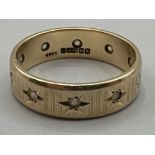 9ct gold hallmarked band with white stones - Weighing 4.03 grams - Size R