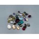 Approximately 230cts of an array of gemstones to include but not limited to ; Amethyst, Citrine,