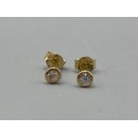 Ladies 18ct gold diamond stud earrings (.58g)