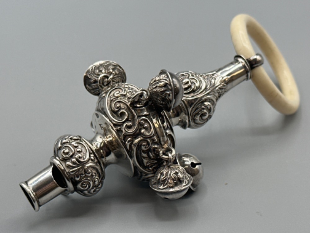 An Edwardian silver baby’s rattle/whistle by E.J.Trevitt & sons, Chester 1905, with bone handle,